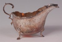 Lot 476 - A silver sauceboat, having an acanthus leaf...