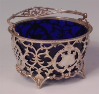 Lot 480 - An Edwardian silver table basket, having blue...