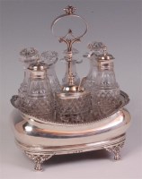 Lot 483 - A George III silver seven bottle cruet, three...