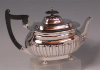 Lot 484 - A Walker & Hall silver teapot, of half reeded...