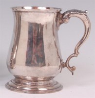 Lot 495 - A George II silver bell shaped tankard, with...