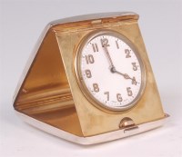 Lot 498 - A George V silver cased travel clock, with...