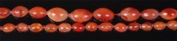 Lot 515 - A beaded agate long necklace, the oval beads...