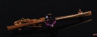 Lot 522 - A 15ct gold amethyst set bar brooch, the oval...