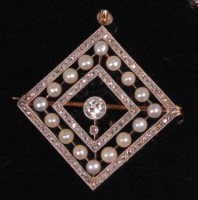 Lot 529 - An Art Deco gold pearl and diamond lozenge...