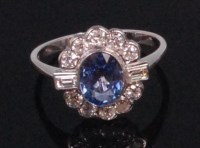 Lot 558 - An 18ct white gold sapphire and diamond set...