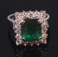 Lot 573 - A contemporary 14ct white gold emerald and...