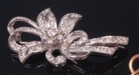 Lot 578 - A ladies white metal and diamond set flower...