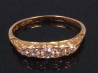 Lot 582 - An Edwardian 18ct gold five stone dress ring,...