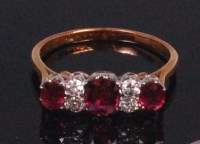 Lot 584 - An 18ct yellow gold ruby and diamond dress...