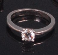 Lot 585 - A contemporary platinum diamond solitaire ring,...