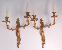 Lot 636 - A pair of Rococo style gilt bronze two branch...