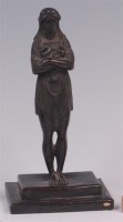 Lot 638 - An Egyptian style bronze figure of a standing...