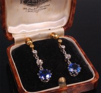 Lot 538 - A pair of 1920s sapphire and diamond drop ear...