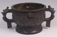 Lot 676 - A Chinese Archaistic style twin handled bronze...