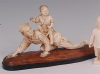 Lot 689 - A Japanese Meiji period carved ivory Okimono,...