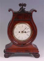 Lot 783 - A late Regency mahogany bracket clock, of lyre...