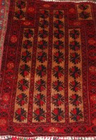 Lot 808 - A Persian woollen prayer rug, the red ground...