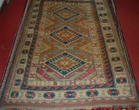 Lot 810 - A Turkish woollen rug, the cream ground...