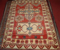 Lot 813 - A Persian woollen Kazak rug, having a complex...