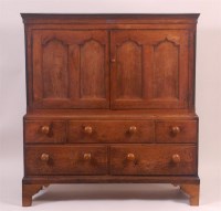 Lot 826 - A George III joined oak housekeepers cupboard,...