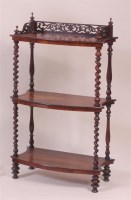 Lot 831 - A Victorian rosewood three tier whatnot,...