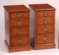 Lot 837 - A pair of satin walnut four drawer bedside...