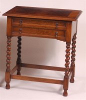 Lot 840 - An oak two drawer side table, having a figured...