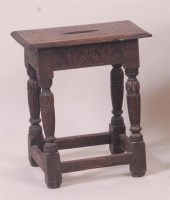 Lot 869 - A circa 1700 oak joint stool, the frieze with...