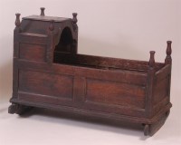 Lot 870 - An antique joined and panelled oak crib, with...