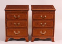 Lot 874 - A pair of satin walnut three drawer bedside...