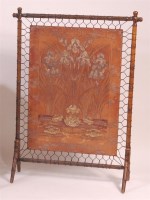 Lot 887 - An Arts & Crafts simulated bamboo and embossed...