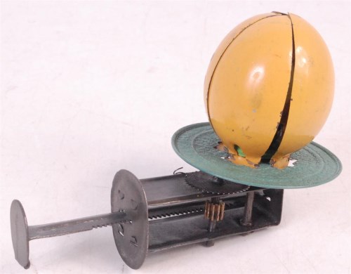 Lot 3155 - 1930s German tinplate spinner toys, 'Egg and...