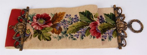 Lot 604 - A Victorian tapestry bell-pull, having cast...