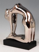 Lot 46 - An Art Deco style silvered ceramic figure of a...