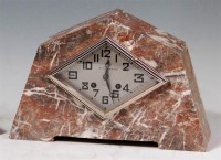 Lot 122 - An Art Deco variegated marble mantel clock, of...