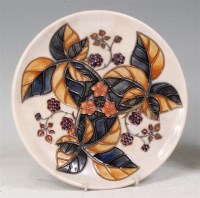 Lot 89 - A modern Moorcroft circular wall plate in the...