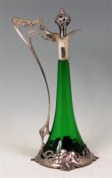 Lot 100 - A WMF Art Nouveau pewter and green glass...