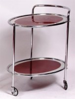 Lot 381 - A 1960s chrome two-tier tea trolley, of oval...