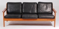 Lot 395 - A 1960s Danish oak framed three seater settee,...