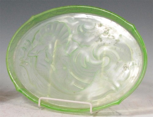 Lot 10 - A French Art Deco moulded and tinted green...