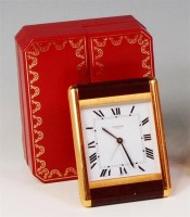 Lot 79 - A boxed Cartier of Paris quartz travel alarm...