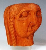 Lot 82 - A Picasso style naively carved wooden female...
