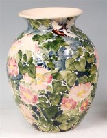 Lot 15 - A glazed ceramic and tube-line decorated vase...