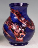 Lot 182 - A modern Moorcroft glazed pottery Dragon vase,...