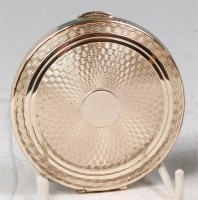 Lot 191 - A 1960s silver compact, of circular form, with...