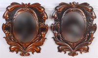 Lot 338 - A pair of Art Nouveau copper wall mirrors, the...