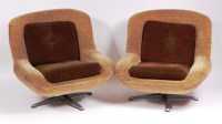 Lot 345 - A pair of 1960s upholstered swivel low easy...