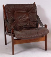 Lot 374 - A 1960s hardwood brown leather buttonback open...