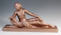 Lot 69 - An Art Deco gilded plaster figure of a seated...